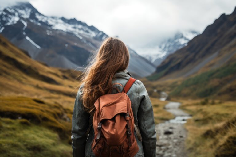 Woman hiker with backpack hiking in Cordillera Blanca, Peru, A female hiker walking to mountains rear view, AI Generated