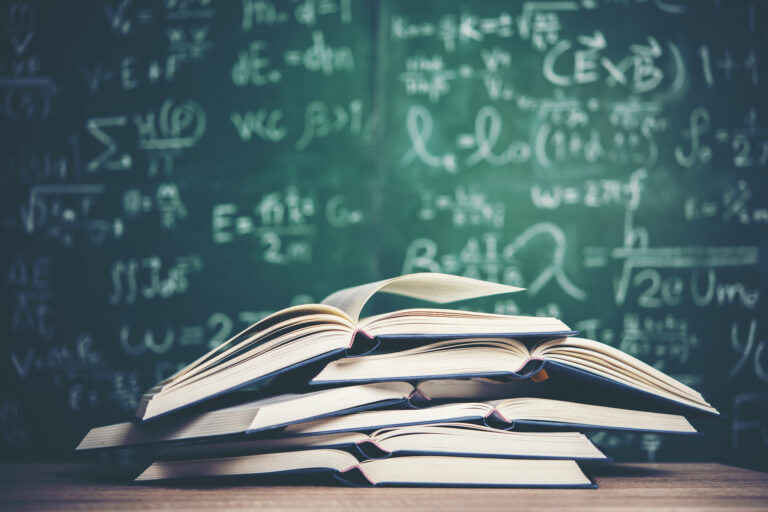 Open book with green board background