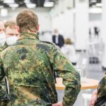 Erste Impfung im COVID-19-Impfzentrum in Halle 4 der Kölnmesse