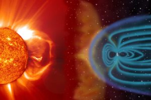 Eine Plasmawolke der Sonne trifft auf das Erdmagnetfeld. Solche Sonnenstürme können Satelliten beschädigen, Navigation stören und Stromausfälle auslösen.